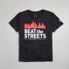 A black t-shirt featuring a graphic of the Philadelphia skyline with the text BEAT the STREETS prominently displayed in white and red