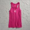 A vibrant pink tank top with a sporty design featuring a stylized logo at the front set against a textured gray background