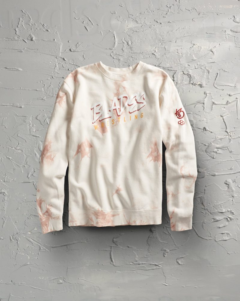 A stylish light sweatshirt showcasing a marble pattern in soft peach tones with bold text reading BLADES WRESTLING