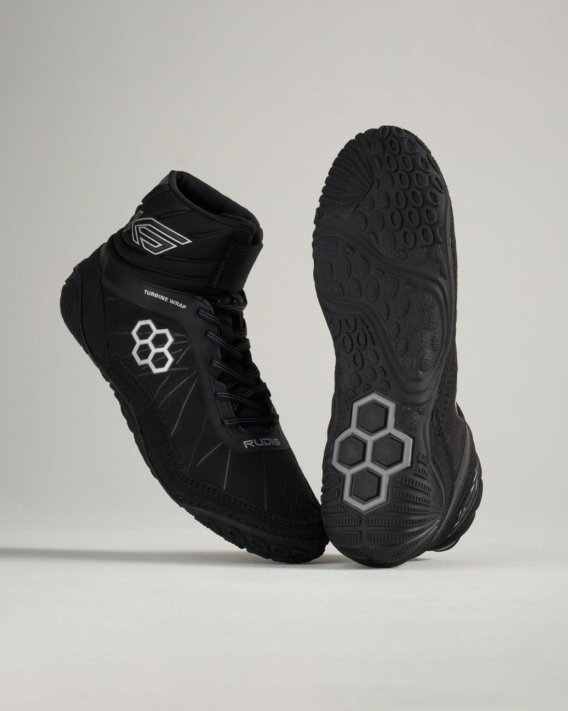 A pair of high-top black training shoes featuring a unique design with hexagonal patterns on the outsole optimal for performance and agility