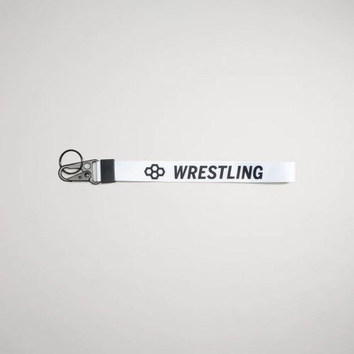 A white fabric strap labeled WRESTLING with a clip designed for holding keys or other small items