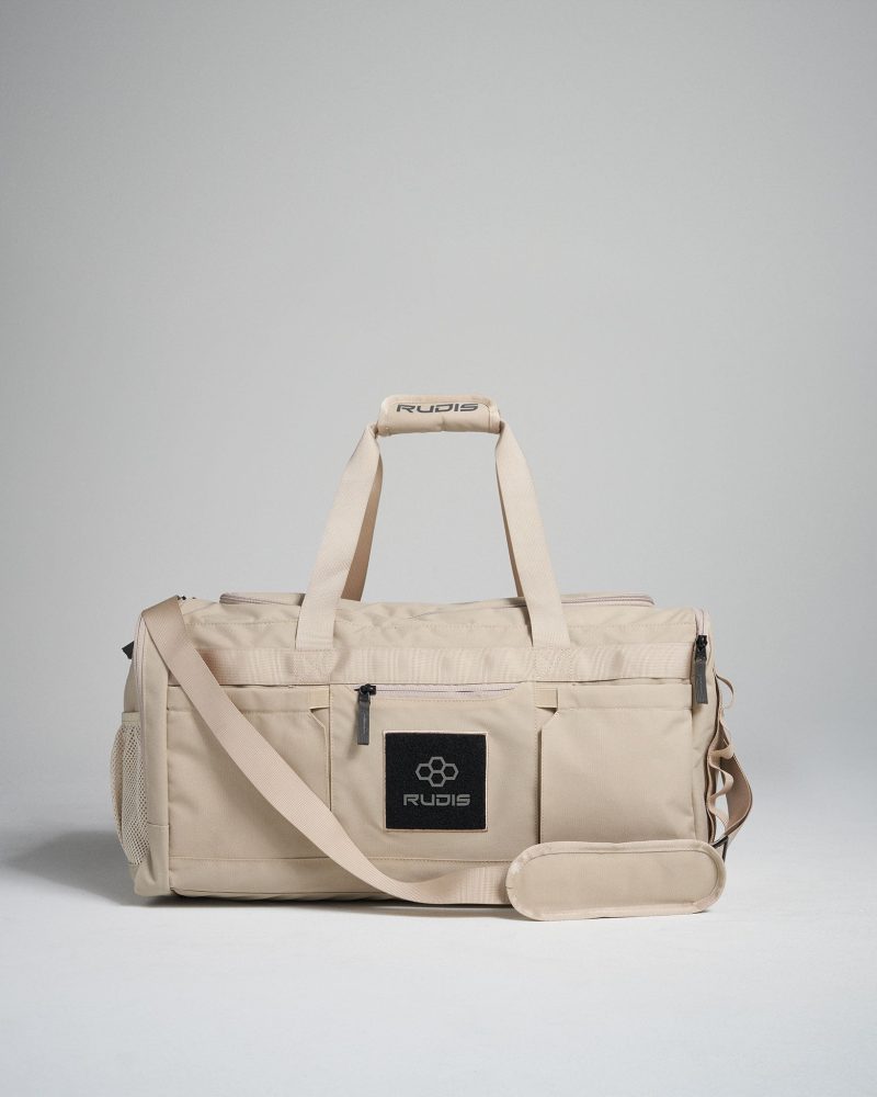 This image features a stylish beige duffel bag designed for versatility showcasing its sleek exterior and brand logo for practical use in various settings