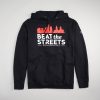 A black hoodie featuring a graphic design with the phrase BEAT the STREETS PHILADELPHIA and a skyline silhouette in red