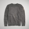 A stylish gray sweatshirt featuring city names in bold typography including Istanbul London and Las Vegas with an emblem on the sleeve