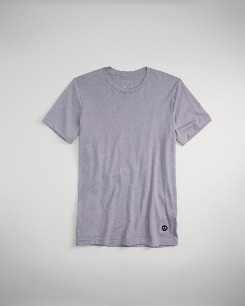 A gray T-shirt with a classic crew neckline and a small logo near the hem displayed on a light background for a clean minimalist look