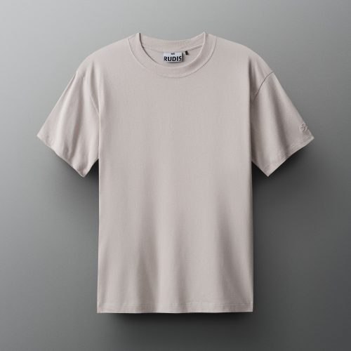 A light beige T-shirt with a round neckline and short sleeves is displayed against a muted gray background, showcasing a comfortable texture and subtle branding.