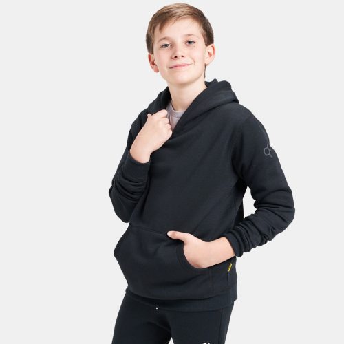 A boy wearing a black hoodie with a relaxed fit complemented by casual black pants poses confidently while smiling at the camera