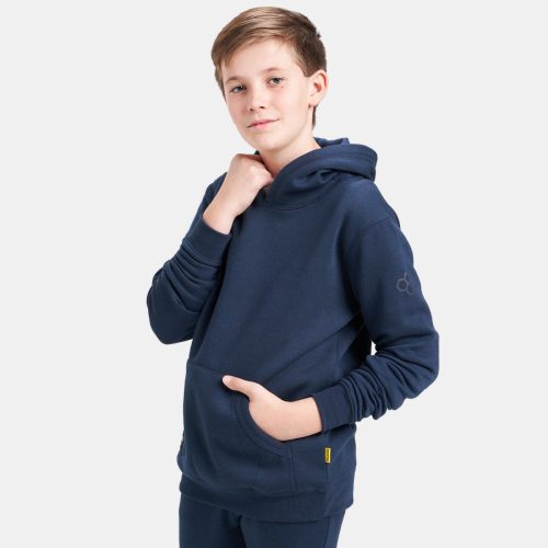 A young boy wearing a navy blue hoodie stands confidently with his hand in his pocket showcasing a casual yet stylish look