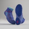 A pair of brightly colored blue athletic shoes with red accents and a textured sole designed for performance and style