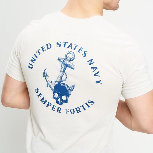 A light-colored t-shirt featuring a prominent blue graphic design on the back showcasing a skull with horns and an anchor along with the text UNITED STATES NAVY SEMPER FORTIS